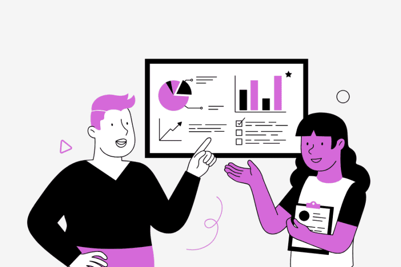 A man and woman review graphs to identify website traffic analytics trends and support Data-driven insights.